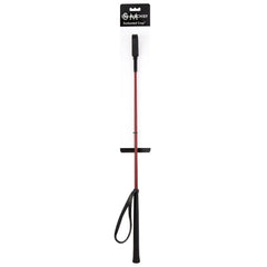 A red and black riding crop with a wrist strap is attached to a white packaging card labeled "Sex & Mischief Enchanted Crop." This carbon fibre crop features a black handle at one end and a small black loop at the other, making it an elegant impact toy for enthusiasts.