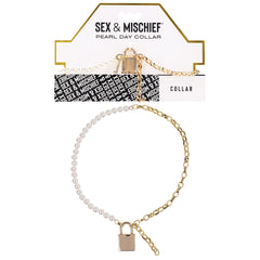 The "Sex & Mischief Pearl Day Collar" comes in a package that showcases its design of half pearl beads and half gold chain, connected by an elegant gold lock charm. This collar offers submissive luxury with its unique blend of materials and features an adjustable length for the perfect fit. The packaging also includes a flat-lay image of the collar.