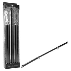 Image of the Master Series Black Steel Adjustable Spreader Bar, crafted from black metal with multiple adjustable rings, perfect for bondage play. Displayed in its packaging and also shown out of the box, this product is designed for restraint purposes and is compatible with wrist and ankle cuffs.