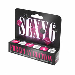 Packaging for the Sexy 6 - Foreplay Edition - Couples Dice Game. The box includes three dice, each featuring different actions and body parts to inspire playful and spontaneous foreplay activities. The packaging is adorned with bold, pink, and black graphics.