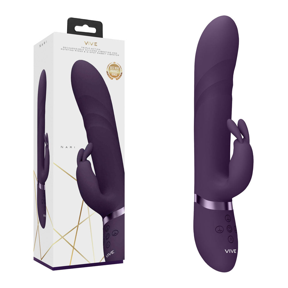 The VIVE Nari G-spot Rabbit Vibrator in purple is displayed adjacent to its packaging. This silicone vibrator features a dual stimulation design, boasting a sleek, curved shaft for precise G-spot stimulation and a smaller arm dedicated to external pleasure. Made from medical-grade silicone, the device ensures both safety and comfort. The box showcases an image of the product along with branding and detailed information.