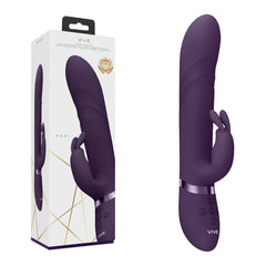 The VIVE Nari G-spot Rabbit Vibrator in purple is displayed adjacent to its packaging. This silicone vibrator features a dual stimulation design, boasting a sleek, curved shaft for precise G-spot stimulation and a smaller arm dedicated to external pleasure. Made from medical-grade silicone, the device ensures both safety and comfort. The box showcases an image of the product along with branding and detailed information.