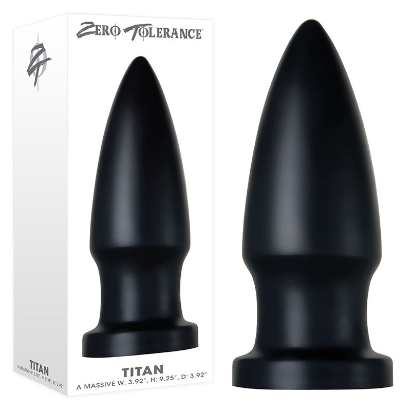 A large, bullet-shaped anal plug with a powerful suction cup base is displayed next to its packaging. The brand "Zero Tolerance" is prominently featured at the top, with the product name "The Titan Butt Plug" at the bottom. With dimensions of Width 3.92 inches, Height 9.25 inches, and Diameter 3.92 inches, it is ideal for advanced anal play enthusiasts.
