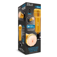 The box of the Zolo Vibrating Personal Trainer is showcased with product images and features, emphasizing hands-free use, a suction mount, various vibration and stimulation modes. The realistic textured canal enhances the hands-free pleasure experience. The box predominantly features black color with orange and blue text.